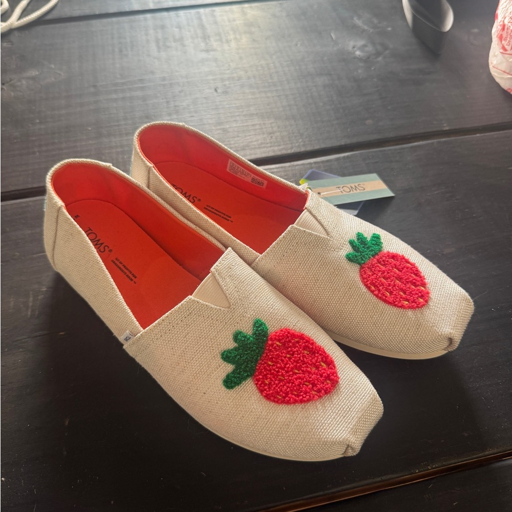 TOMS Cream Slip-On Shoes with Strawberry Design
